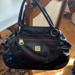 Nwt. Really nice purse with lots of compartments! Gold hardware and zippers!